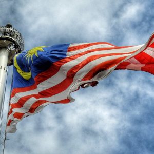 low angle photography of waving flag of Malaysia during daytime
